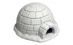 A white igloo with snow on the ground