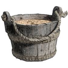 A bucket of sand with rope handles.